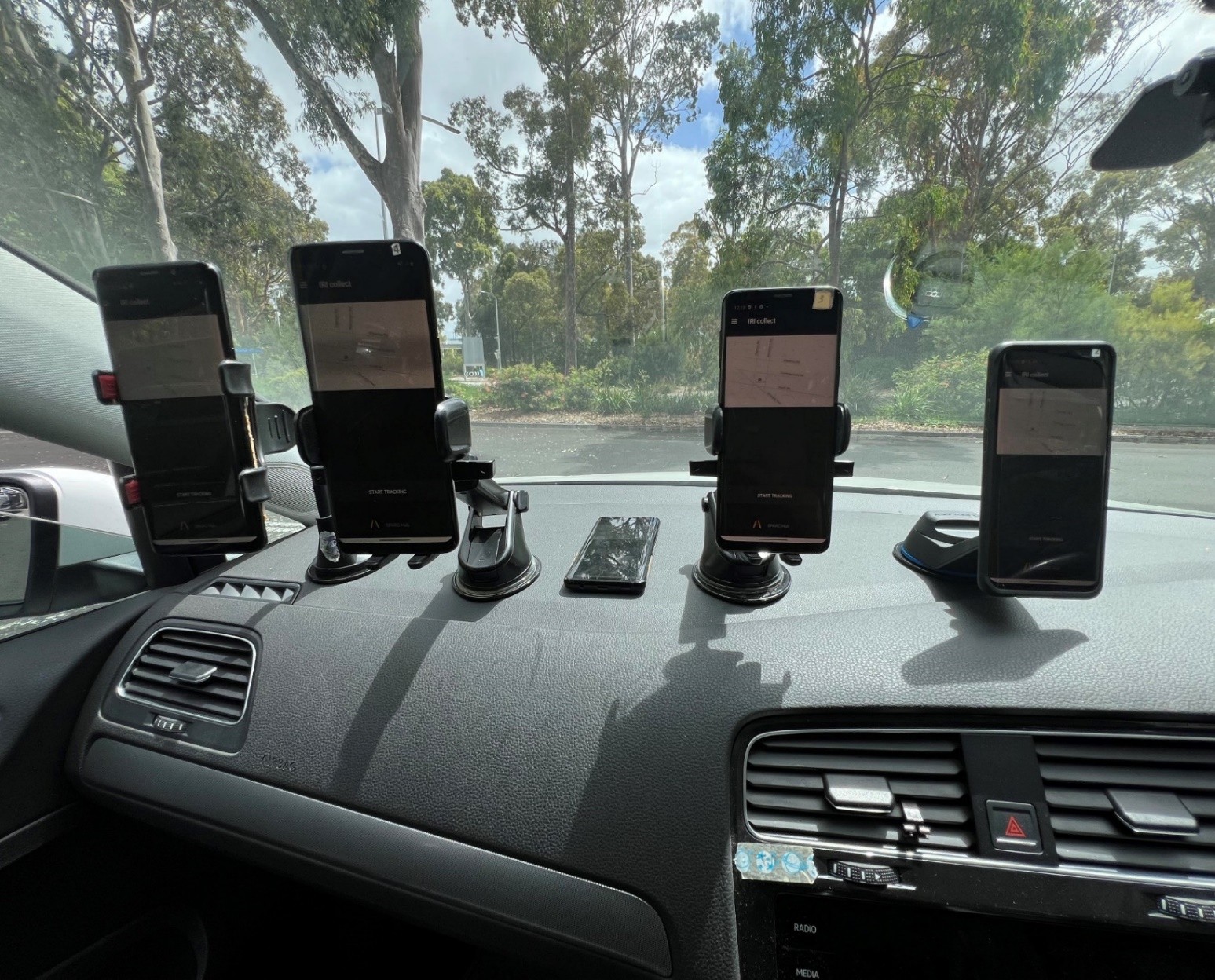 Smartphone mounted in a vehicle for road monitoring